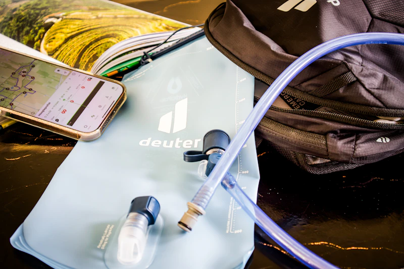 Hiking essentials — water bladder, pack and trail map — laid out