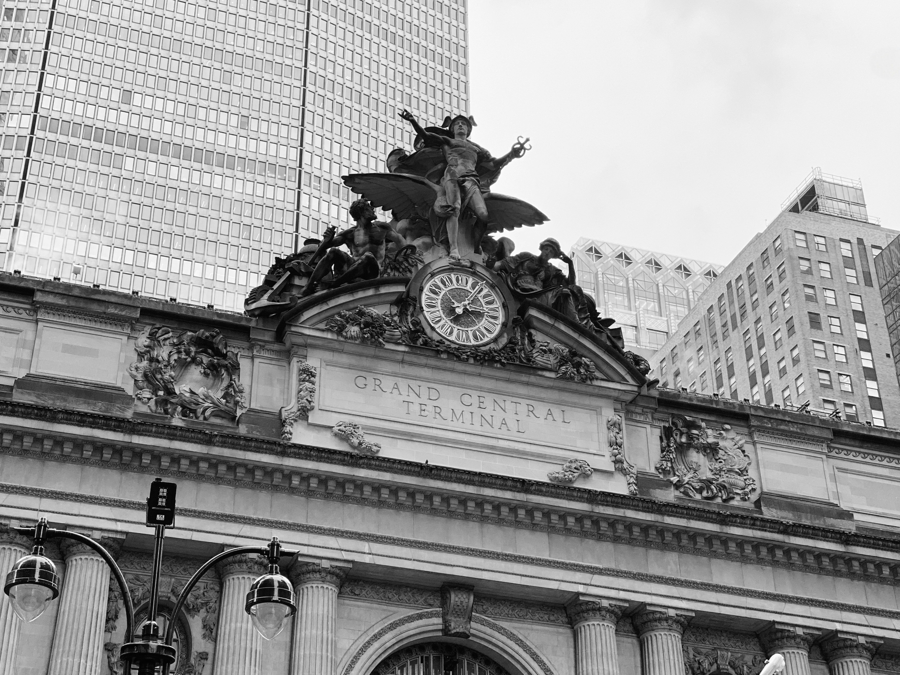 Grand central terminal's facade in black and white.