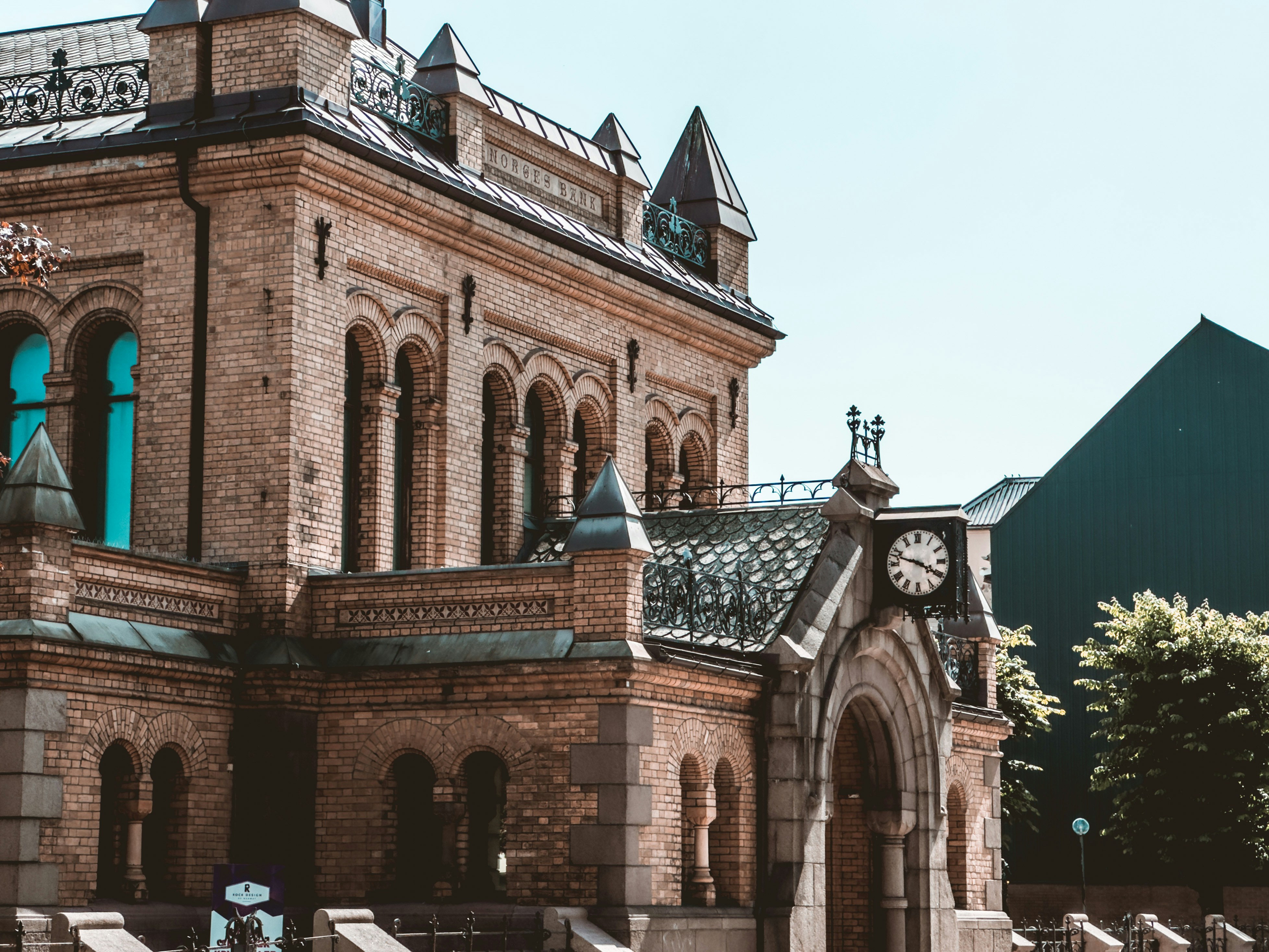 An old, elegant building with clock and turrets.