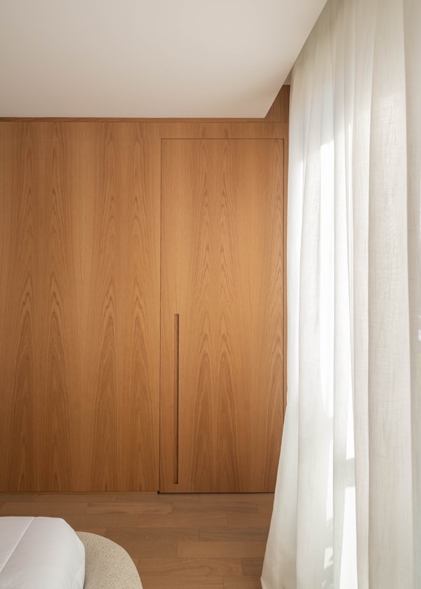 Bespoke floor-to-ceiling timber wardrobe   built-in storage interior design Dubai small apartment