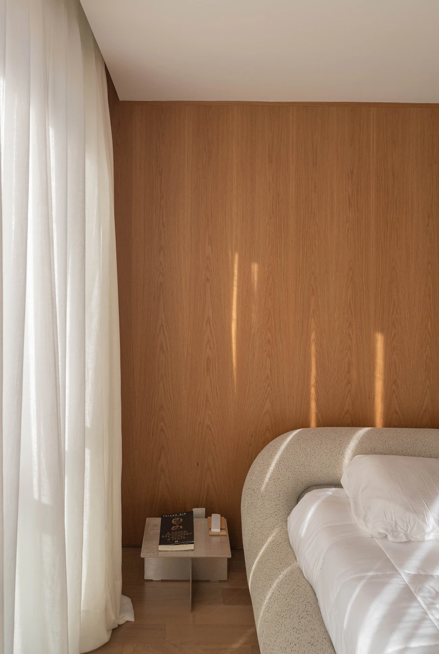 Cozy bedroom with wood paneling