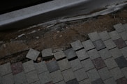 Damaged paving stones are being repaired.