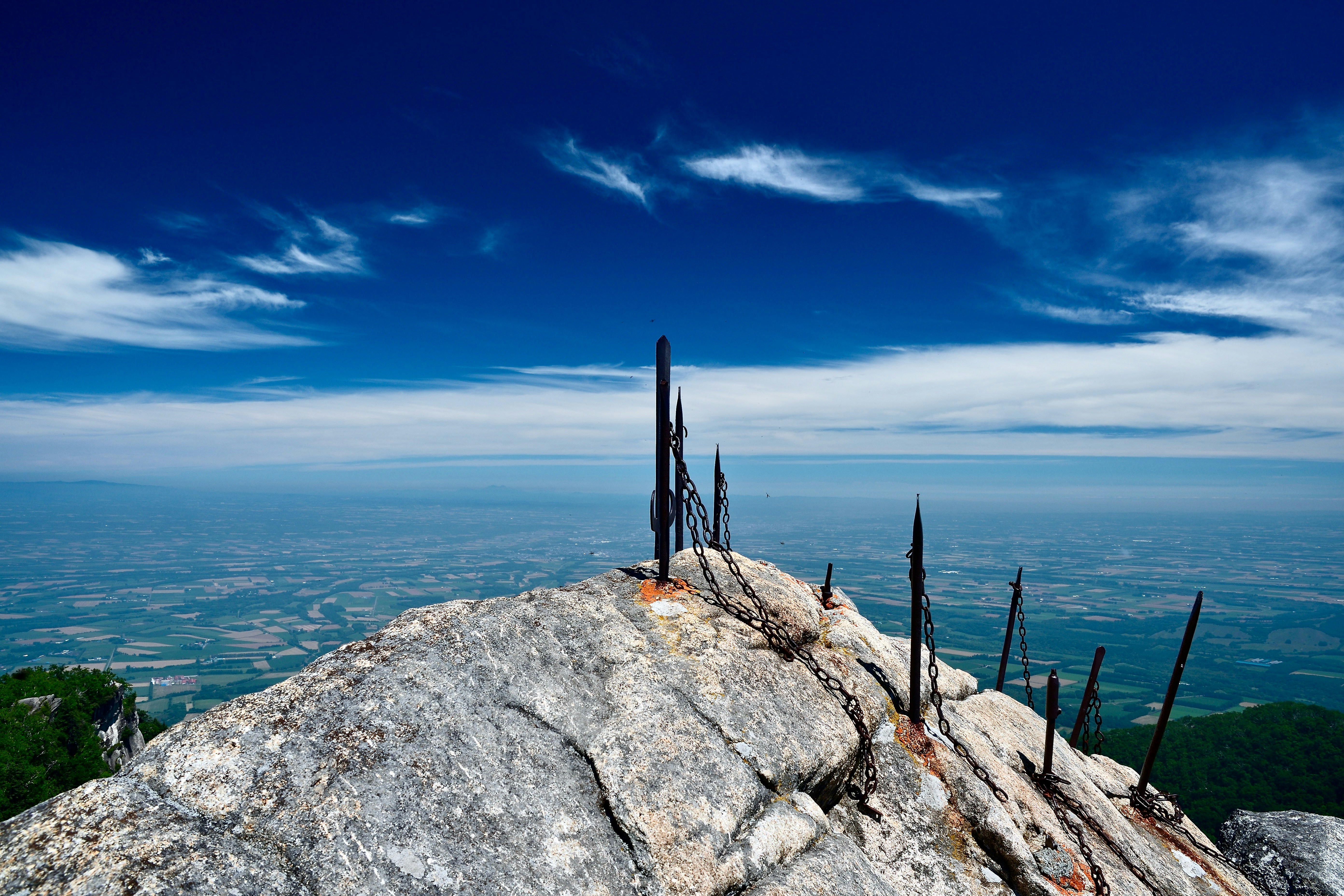 A rocky mountain peak reaches towards the sky.