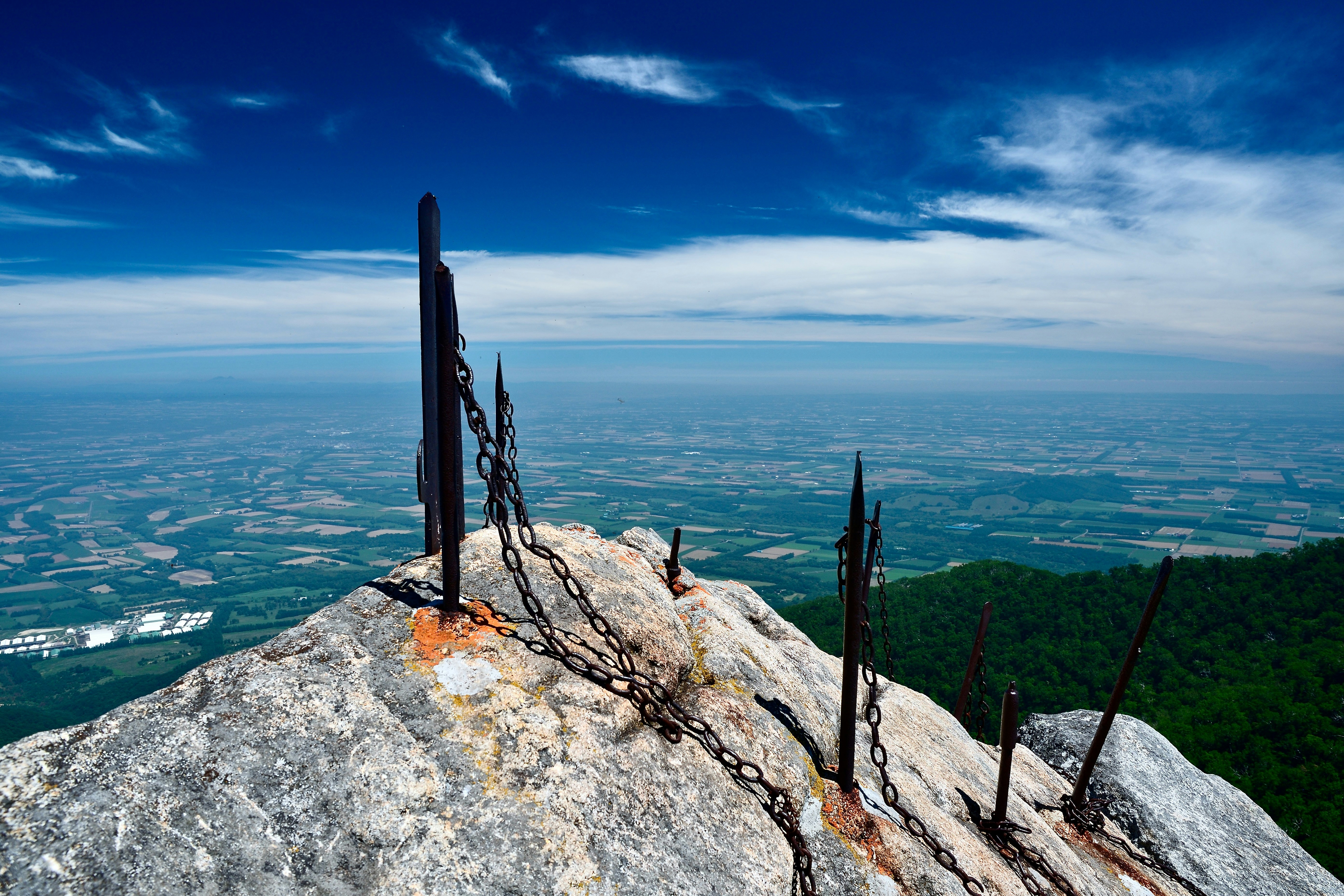 Chains on a mountaintop with beautiful scenery.