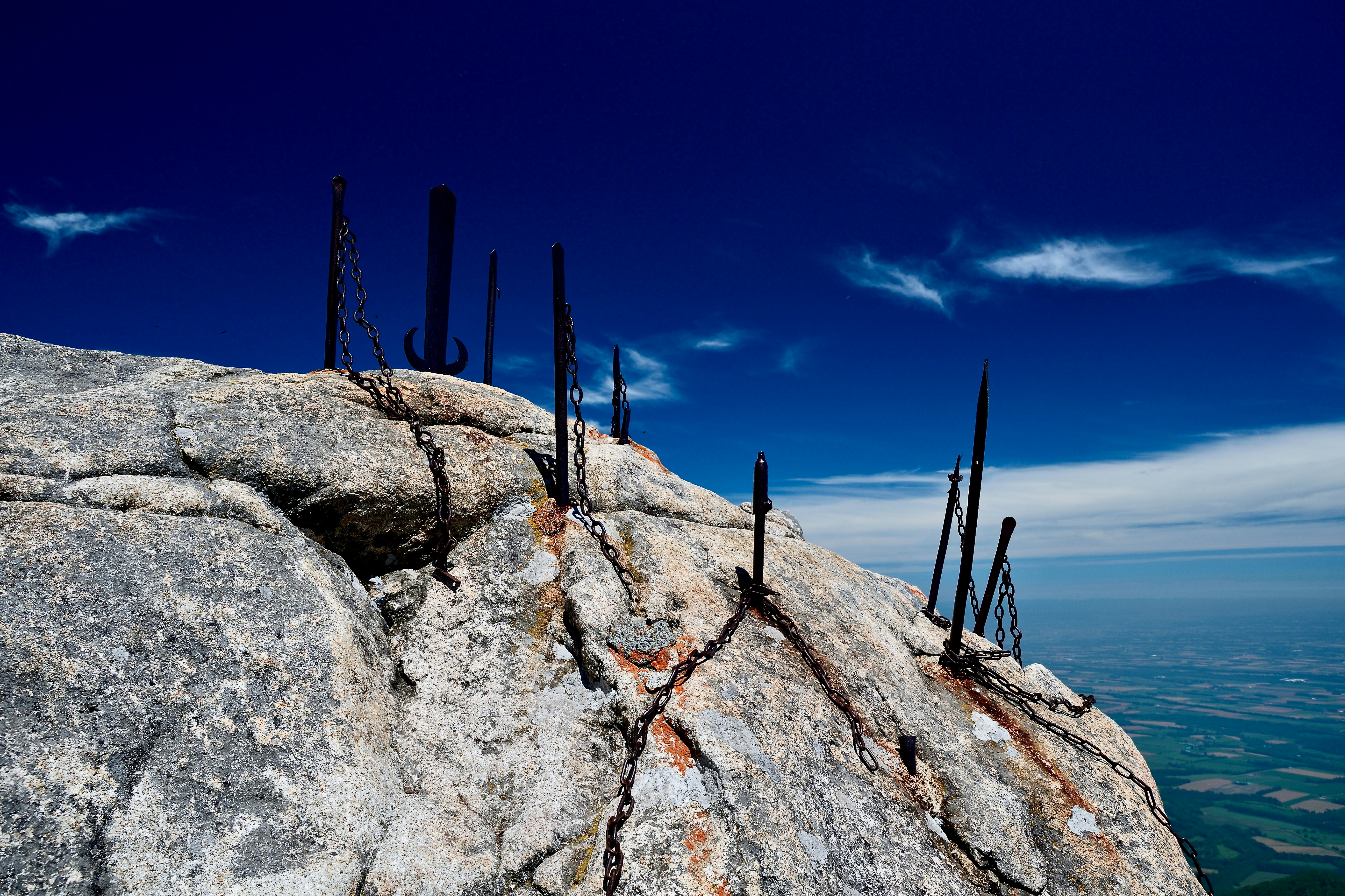 Rock formation underneath a blue sky.