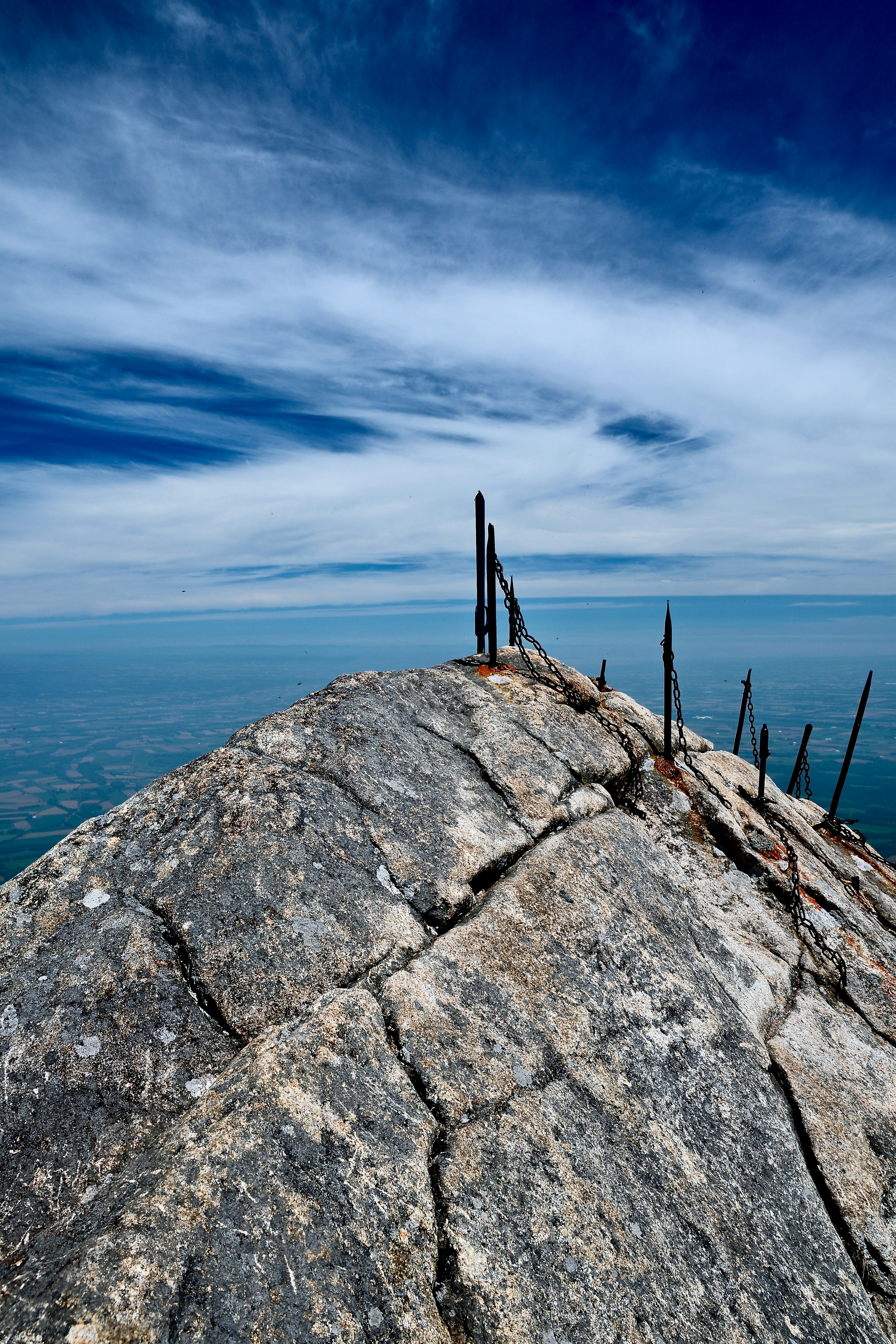 A rocky peak reaches towards the sky.