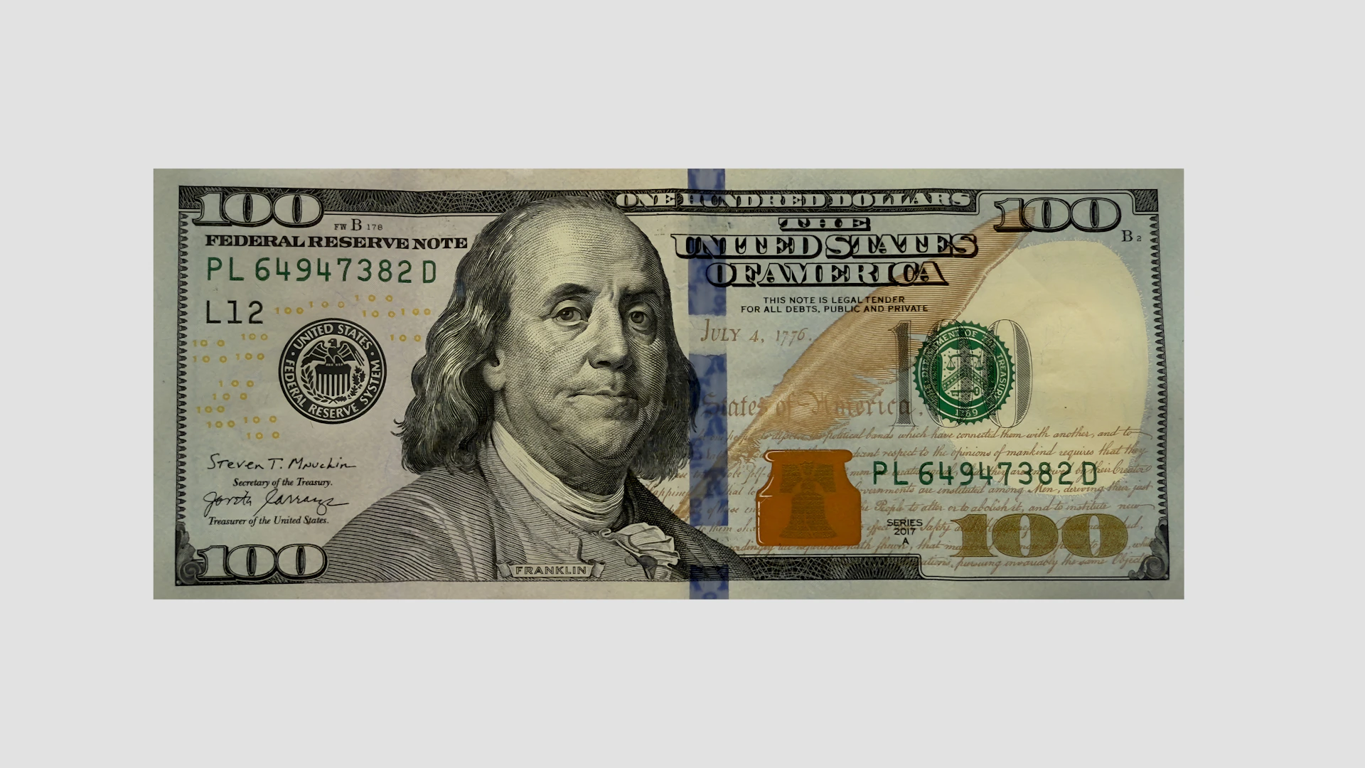 Here's a caption: a close-up of a hundred dollar bill.