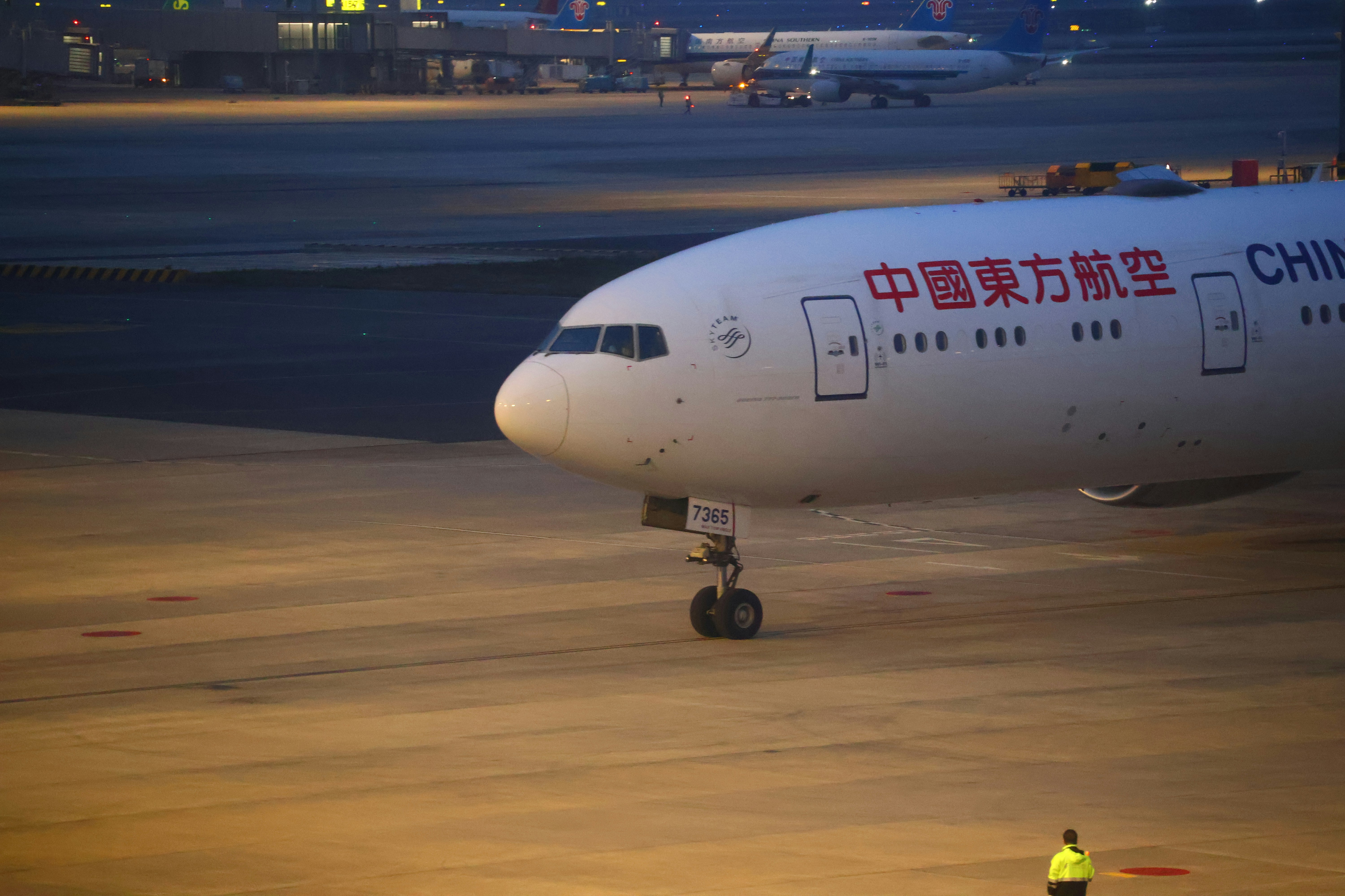A china eastern airlines plane rests on the tarmac., 