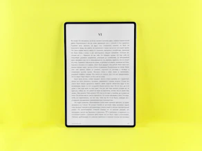 An e-reader displays text on a bright yellow background.