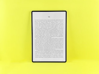 An e-reader displays text on a bright yellow background.