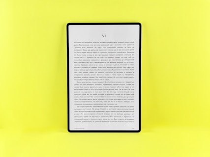 An e-reader displays text on a bright yellow background.
