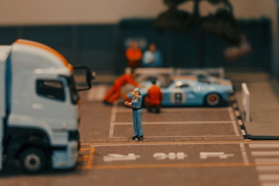 Miniature pit stop scene with a race car.