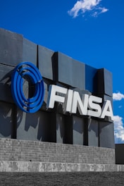 The finsa logo displayed against a blue sky.