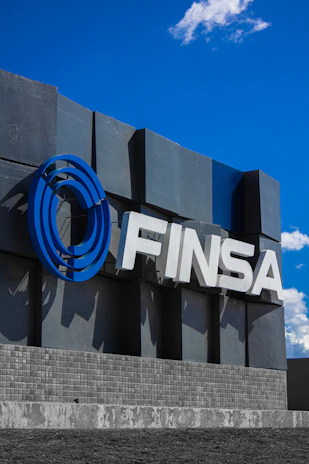 The finsa logo displayed against a blue sky.