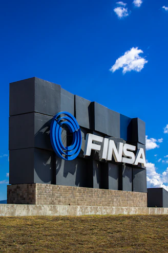 The finsa sign stands prominently against a blue sky.