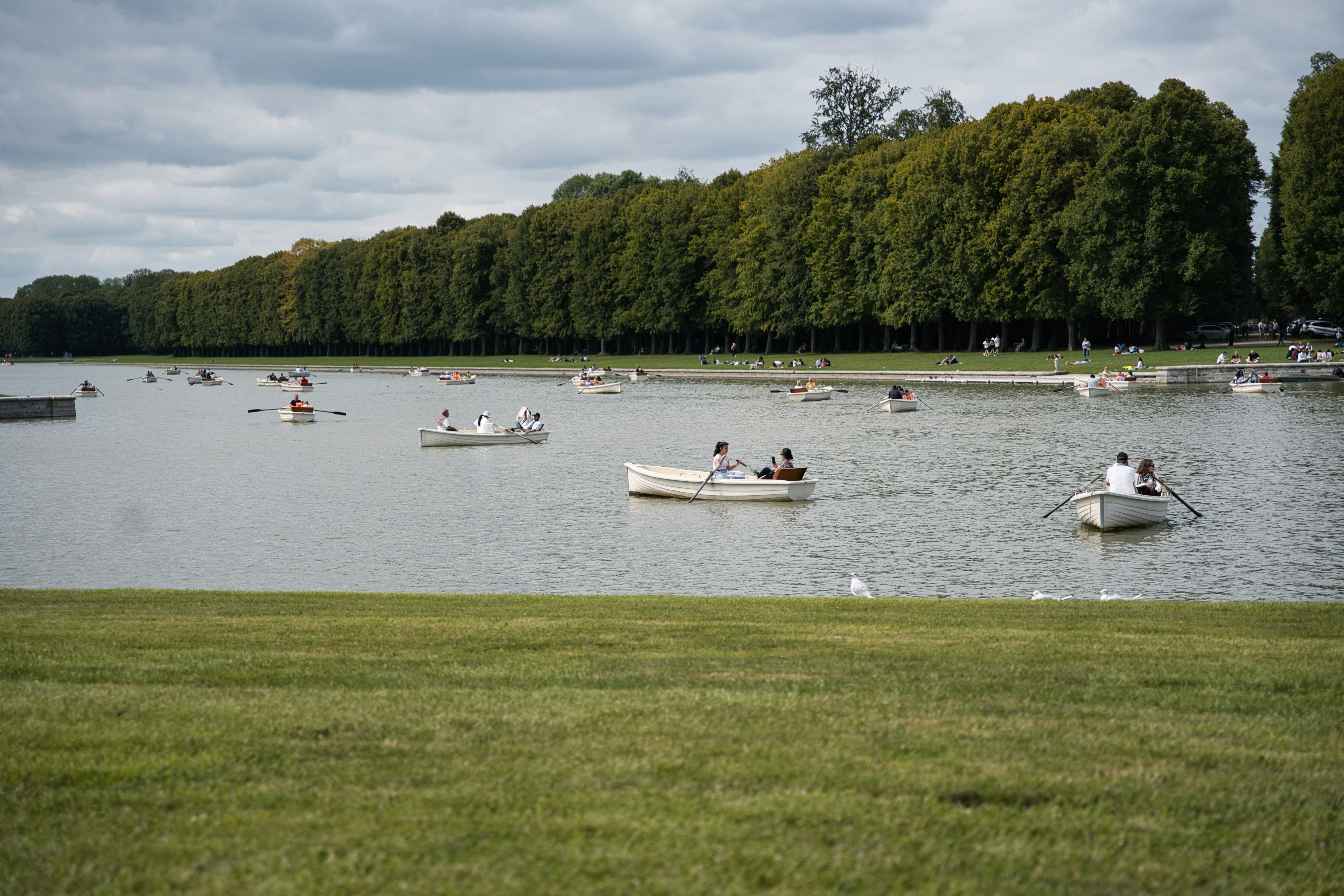 People enjoy boating on a serene lake.