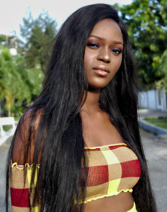 A beautiful woman poses with long, black hair.