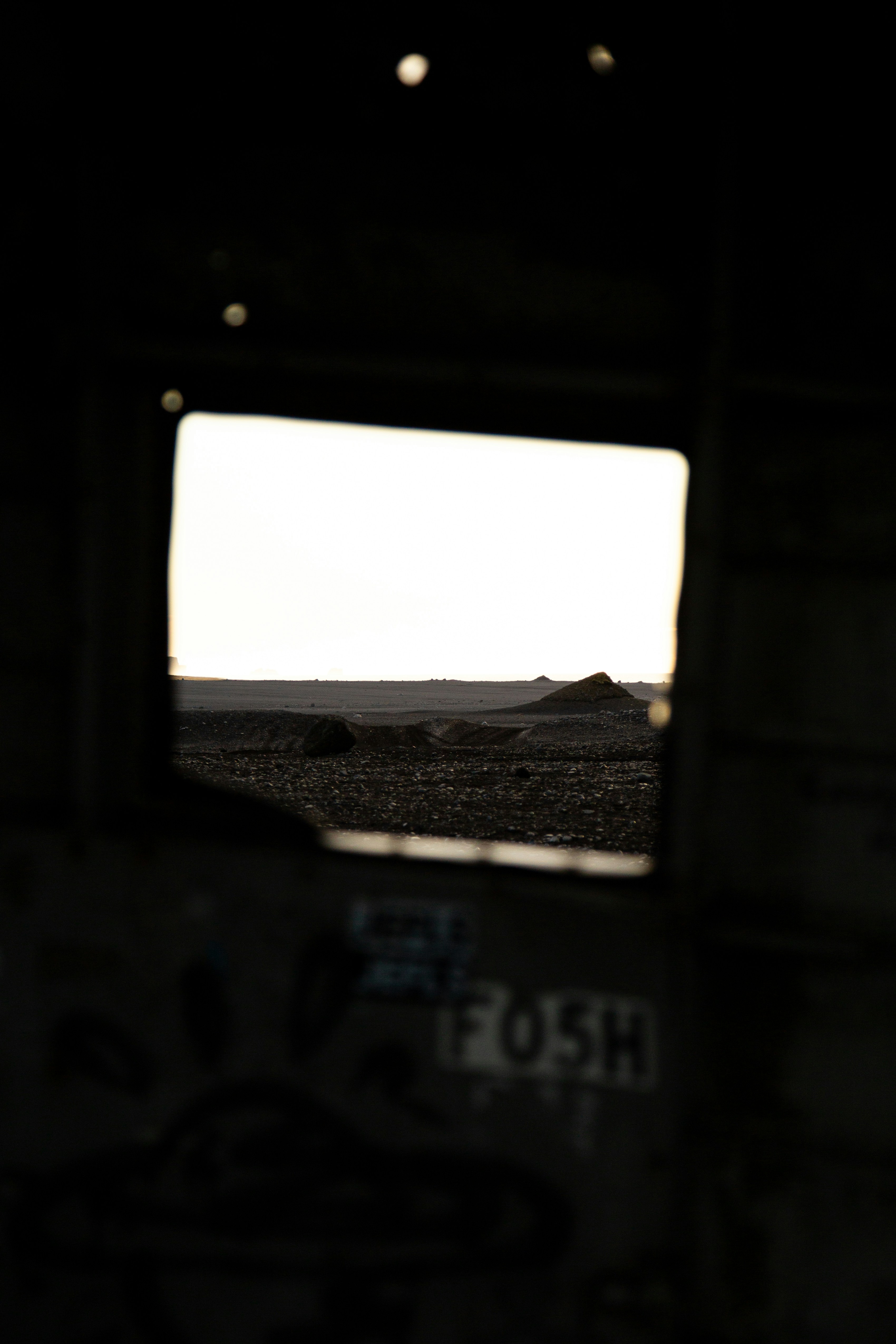 A landscape view through a window frame.
