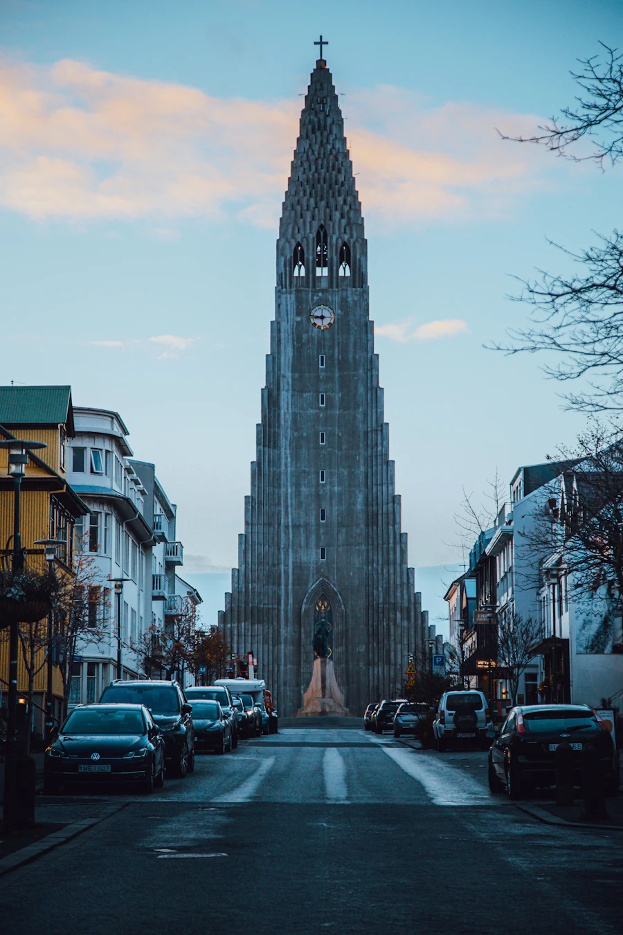 Hallgrímskirkja church towering over a Reykjavík street at dusk