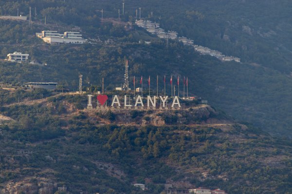 The "i love alanya" sign is on a hill