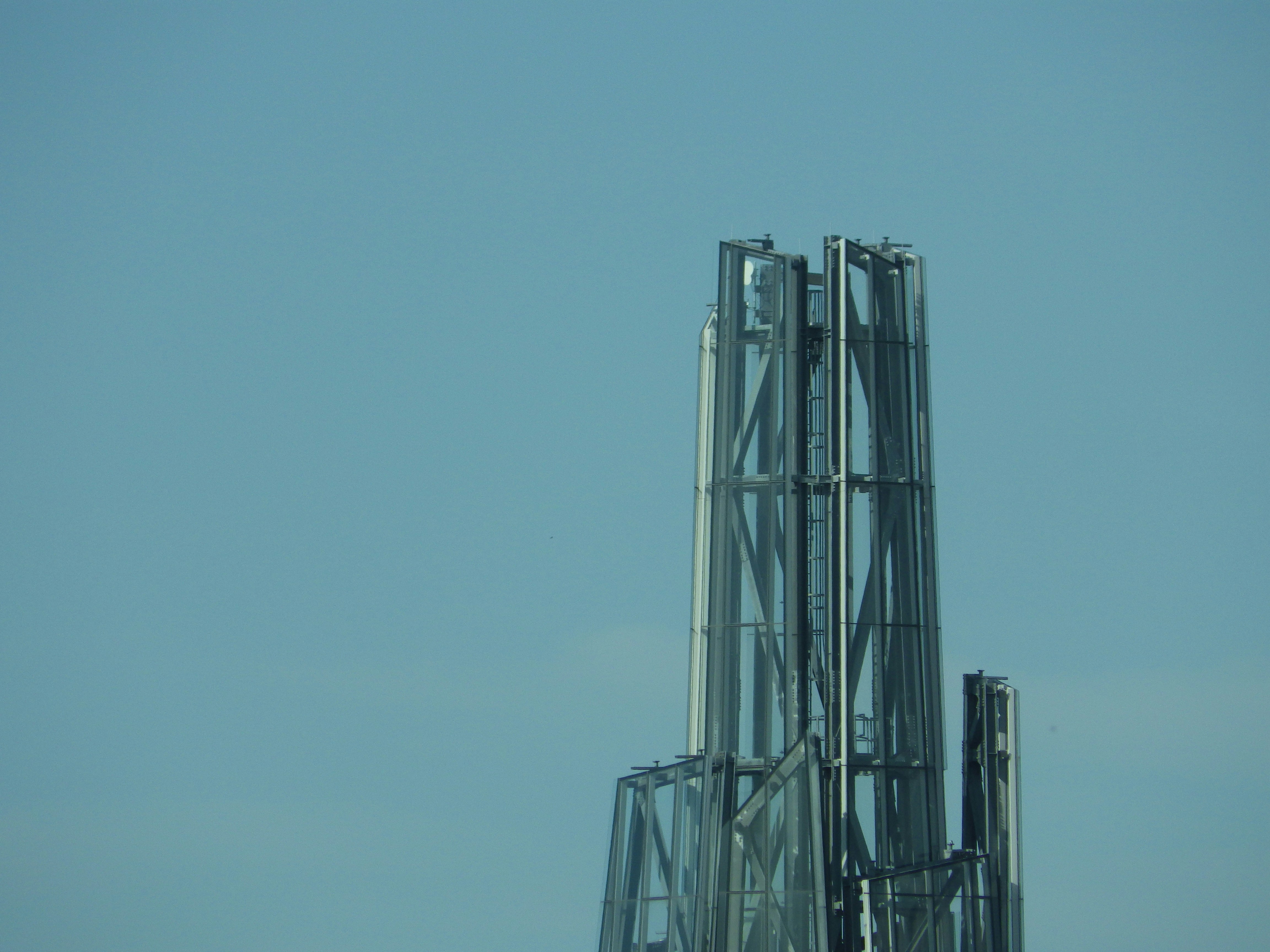 Metal structures reach into the blue sky.