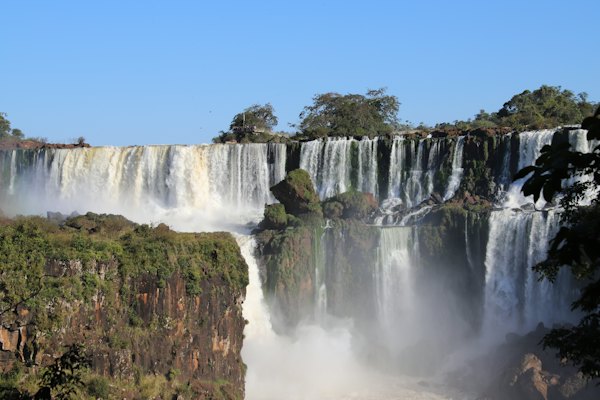A majestic waterfall cascades into a misty abyss — Iguazú Falls, Argentina