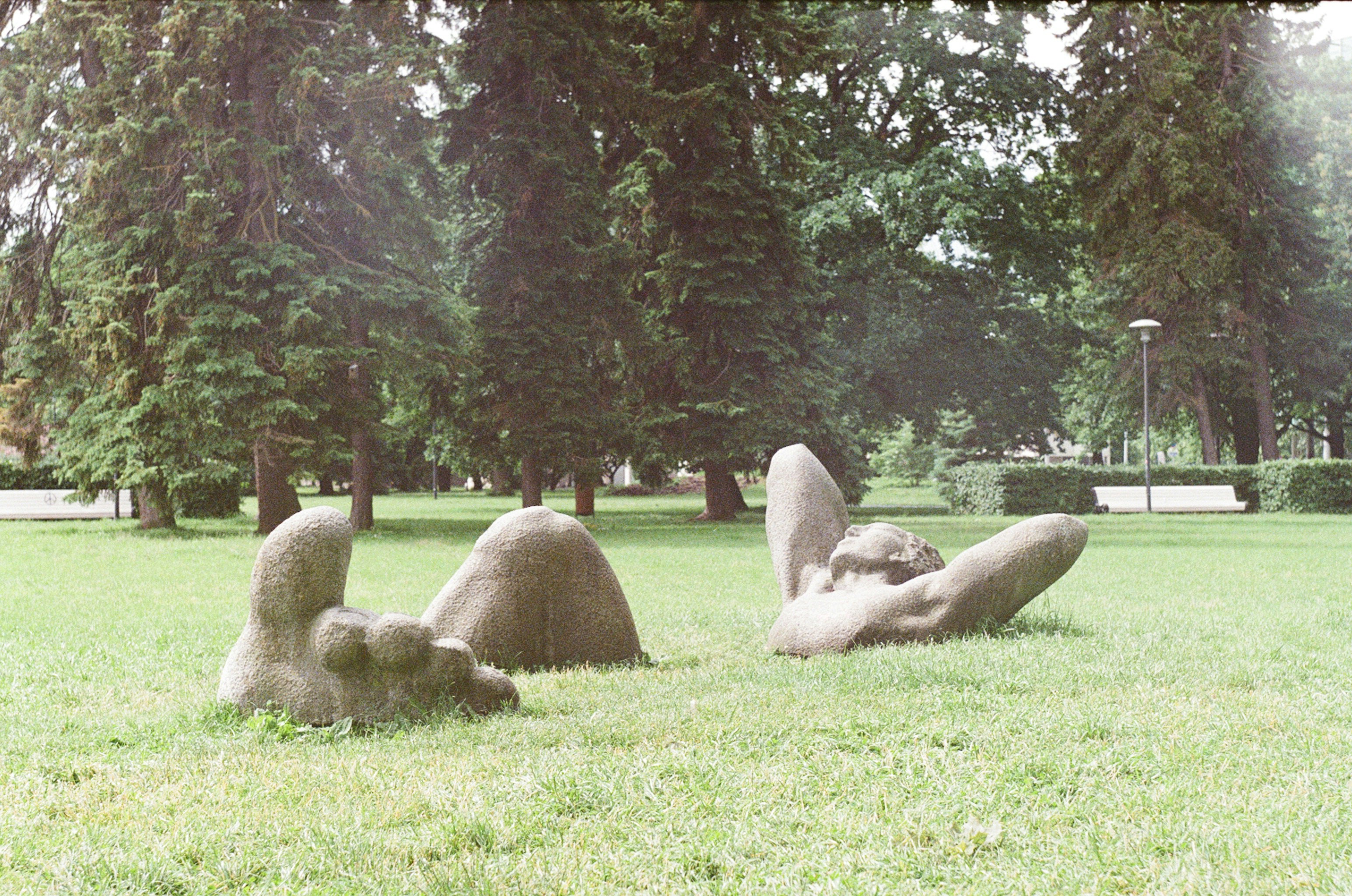 Sculptures of giant hands are emerging from the ground.