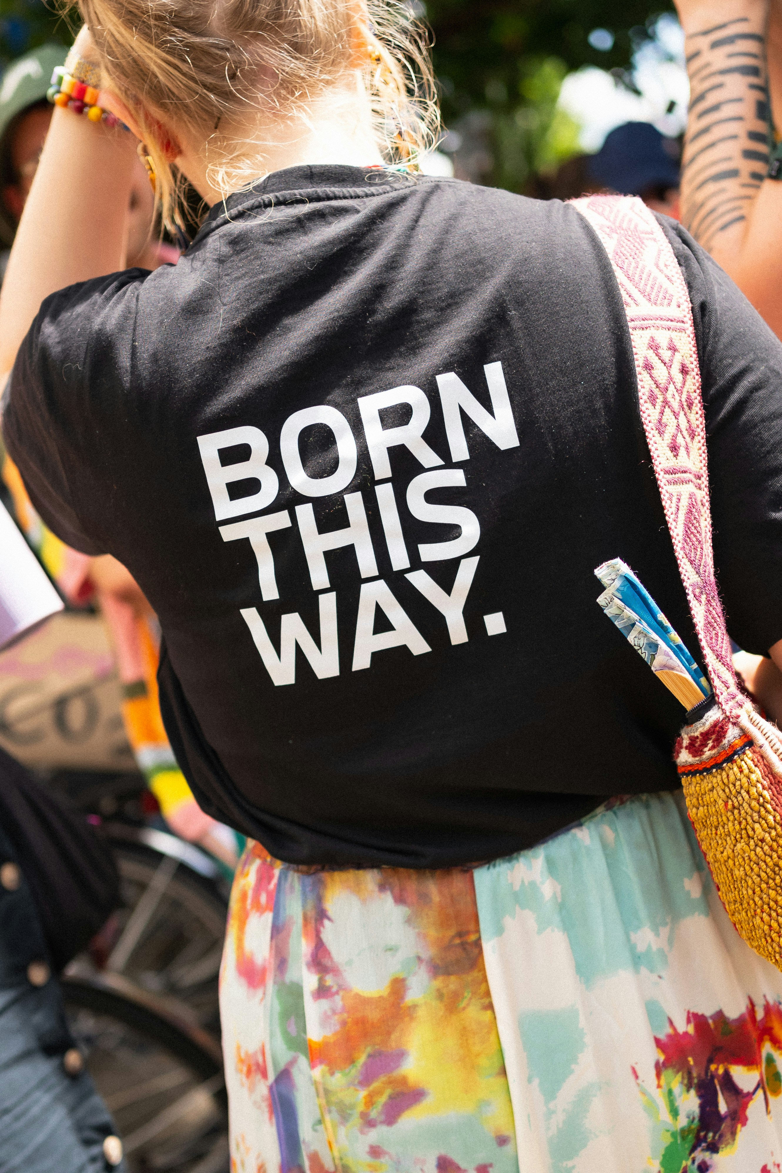 The shirt says "born this way."