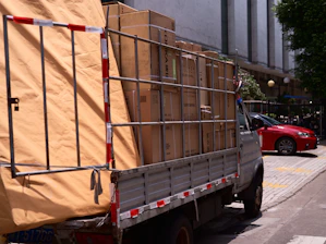 A truck is loaded with boxes and other items.