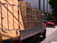 A truck is loaded with boxes and other items.
