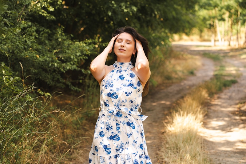 Woman relaxes outdoors, enjoying the sunlight.