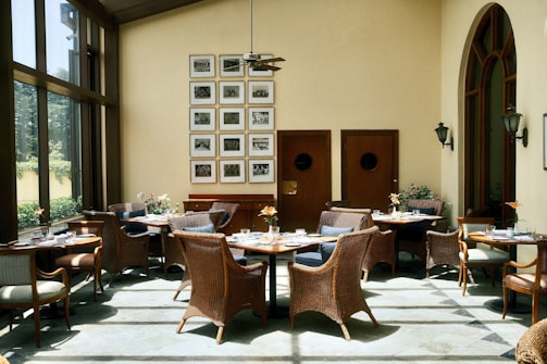 Cozy restaurant dining area with wicker chairs.