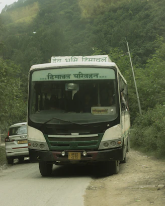 A bus travels down a mountain road.