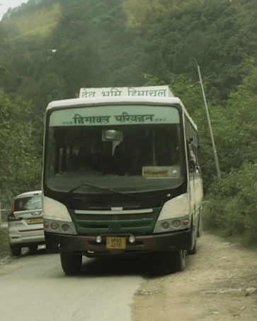 A bus travels down a mountain road.