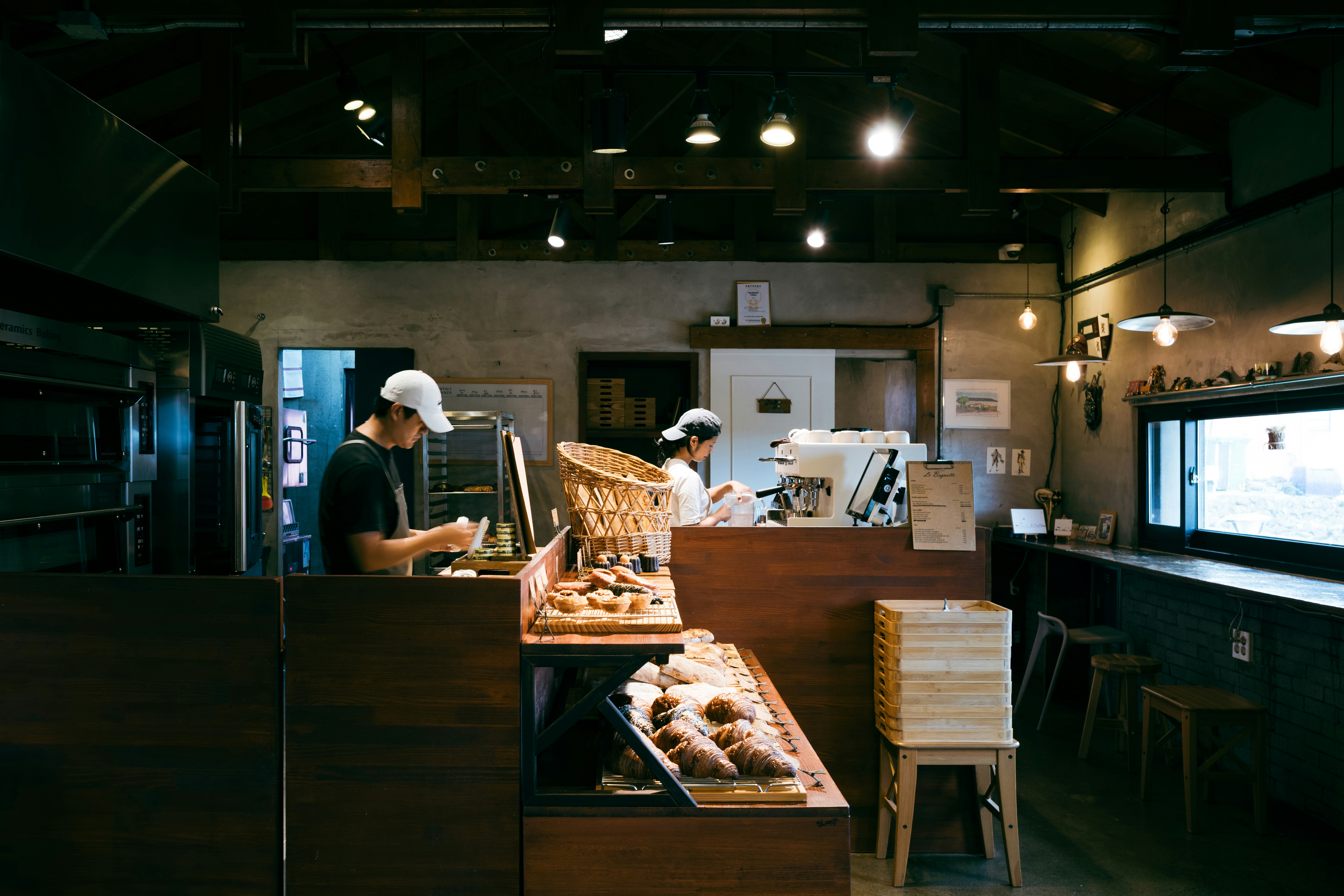 A bakery interior: bakers prepare bread.