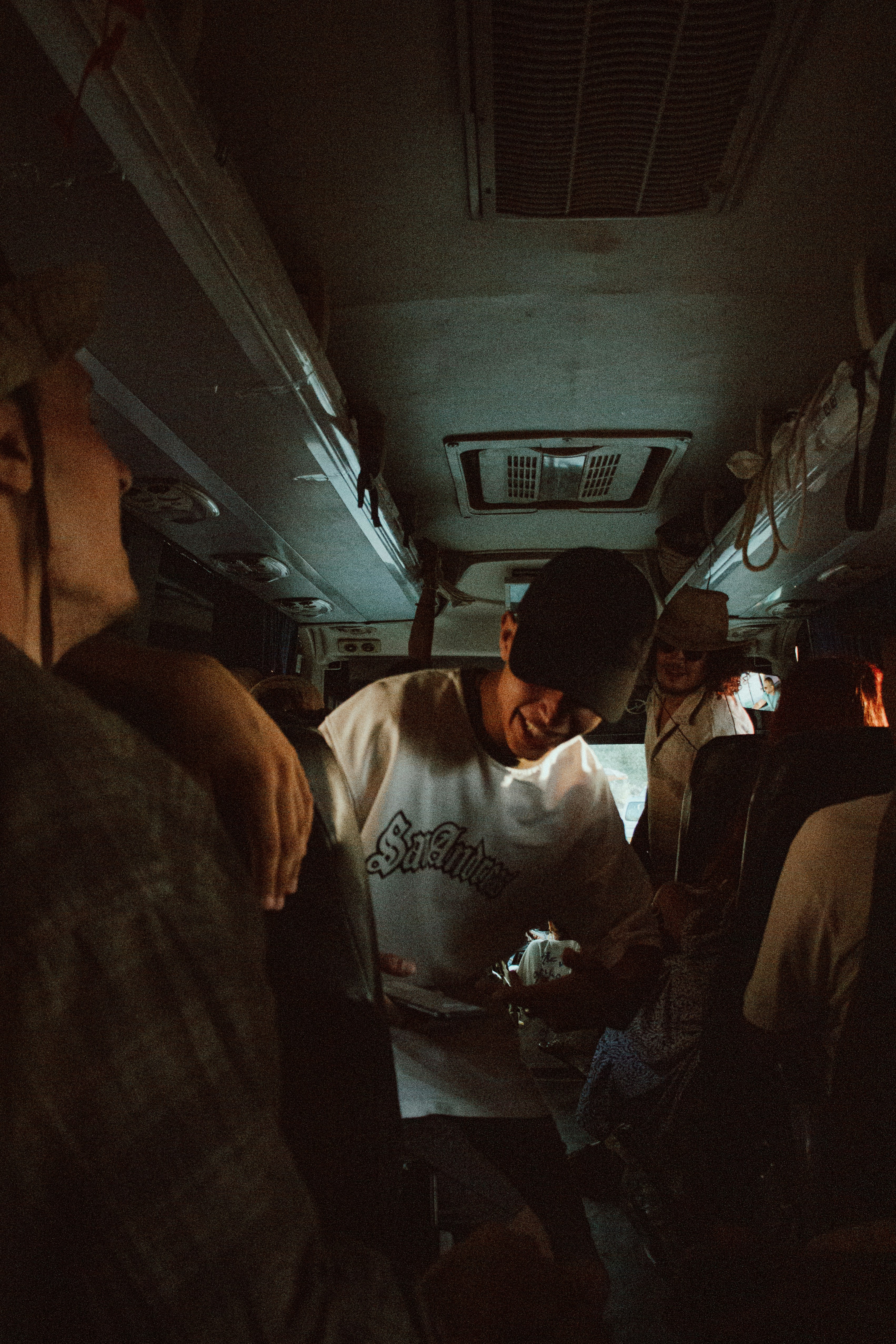 People inside a bus, appearing to be enjoying themselves.