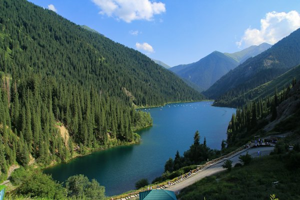 A beautiful lake surrounded by tall green trees — Kolsay Lakes, Kazakhstan