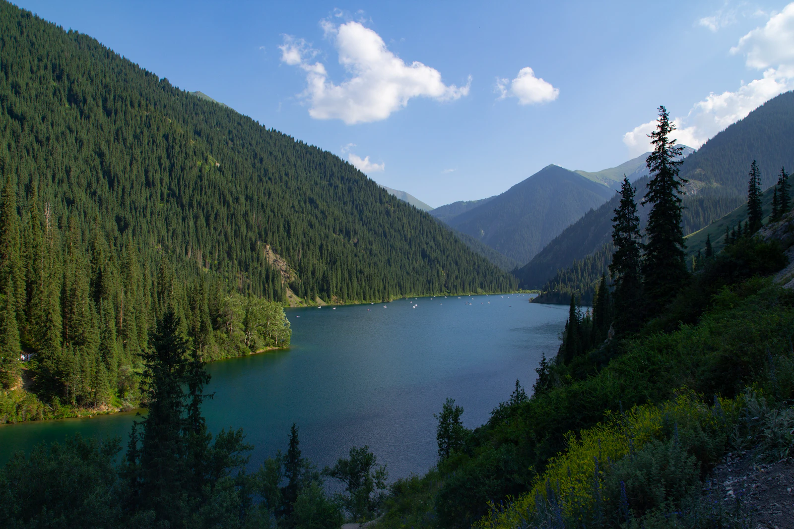 The first Kolsay lake, dark green between forested slopes of the Tien Shan