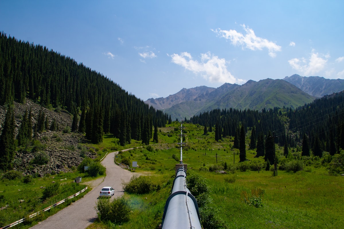 Pipeline running through a green valley landscape