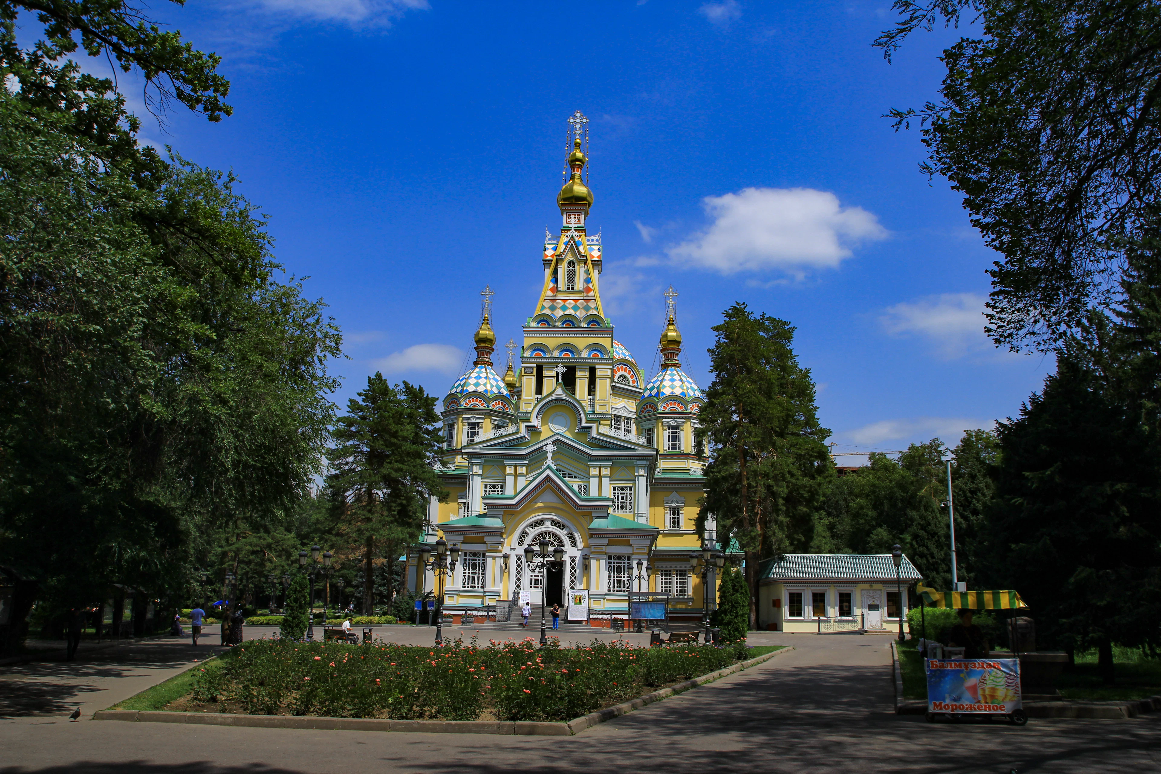 Almaty's Zenkov Cathedral, its painted timber facade and gold spires set in Panfilov Park