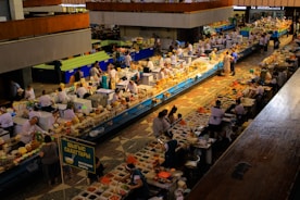 A busy market is filled with vendors and customers.