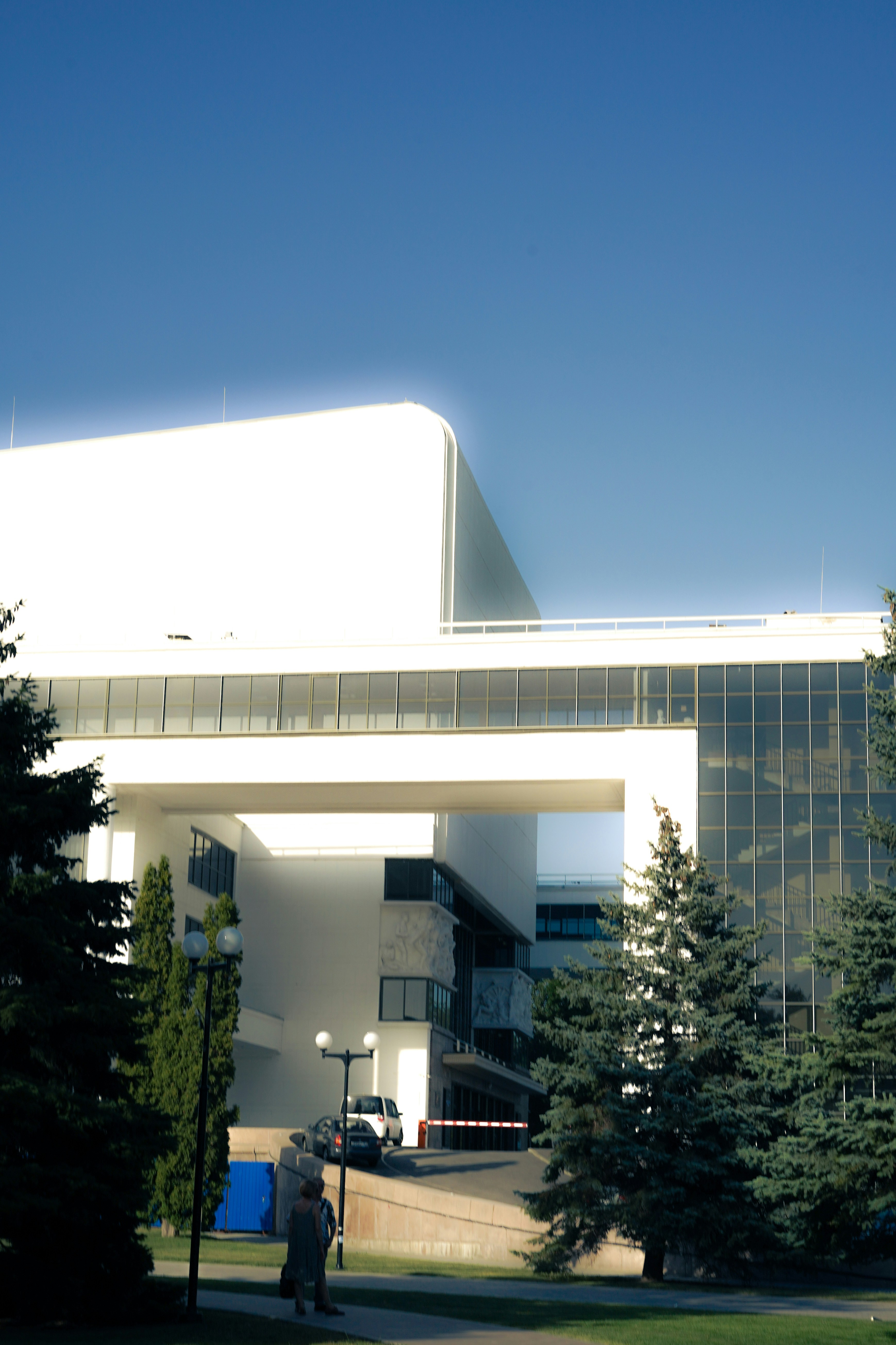 Modern white building against a blue sky.