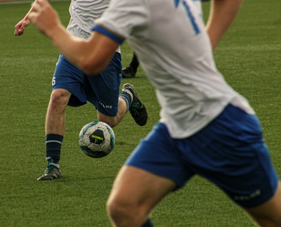 Soccer players are shown during a match.