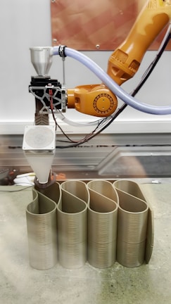 A 3D printer is manufacturing an object.