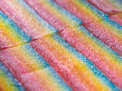Rainbow candy stripes arranged in a close up shot.
