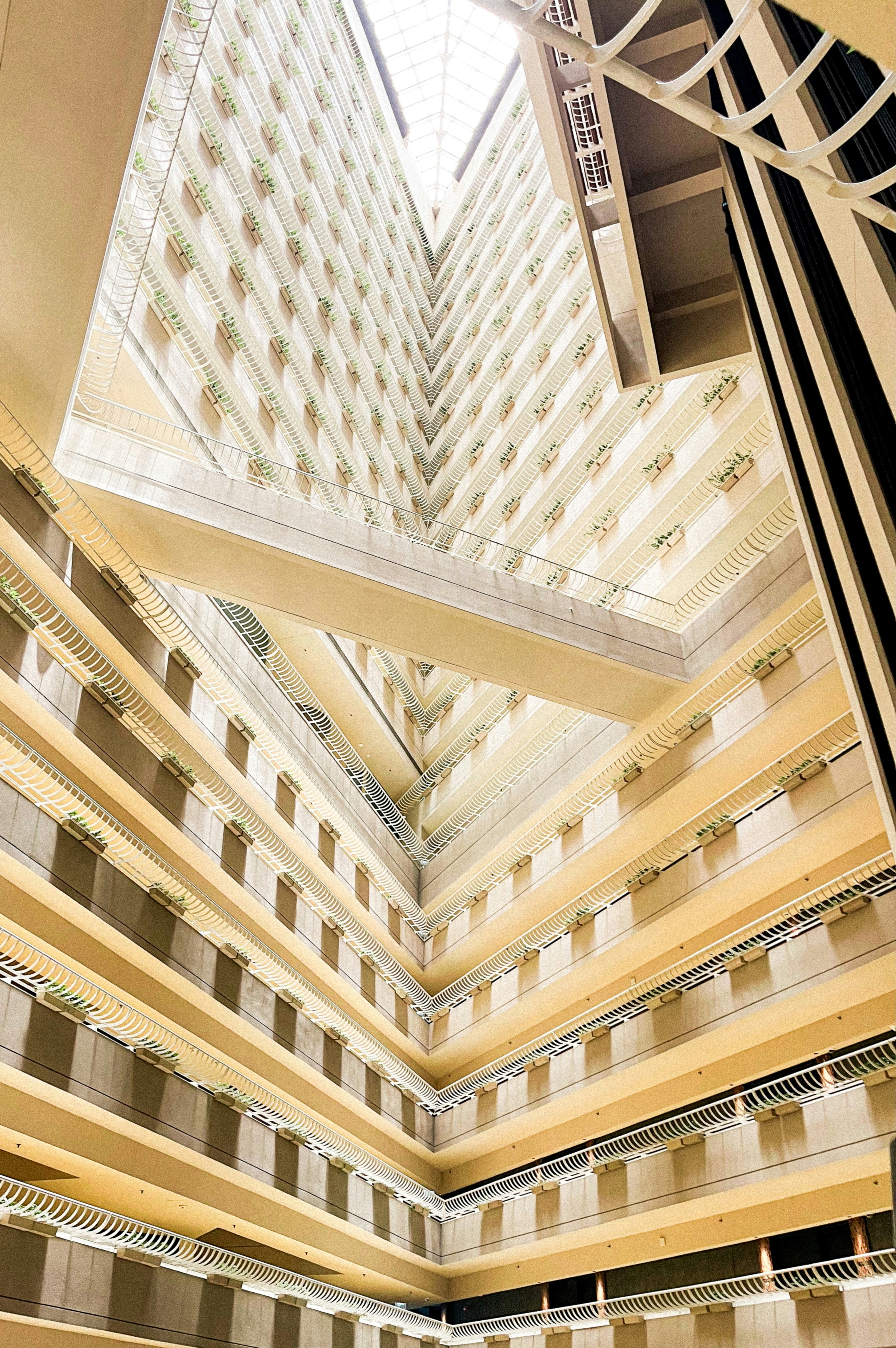 Interior view of an atrium in a tall building.