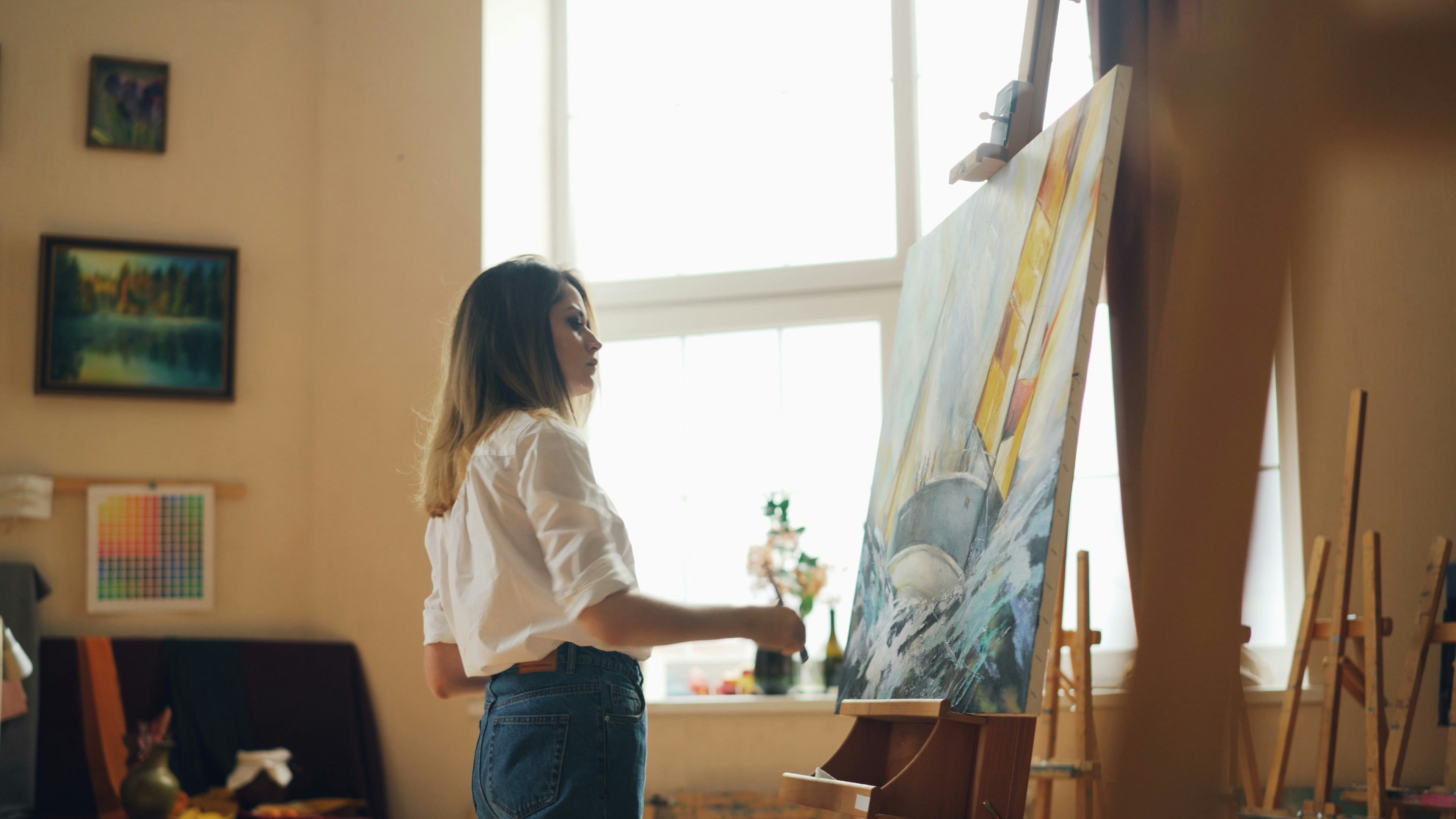 Amanda Anisimova painting on a canvas, showcasing her artistic side - amanda anisimova