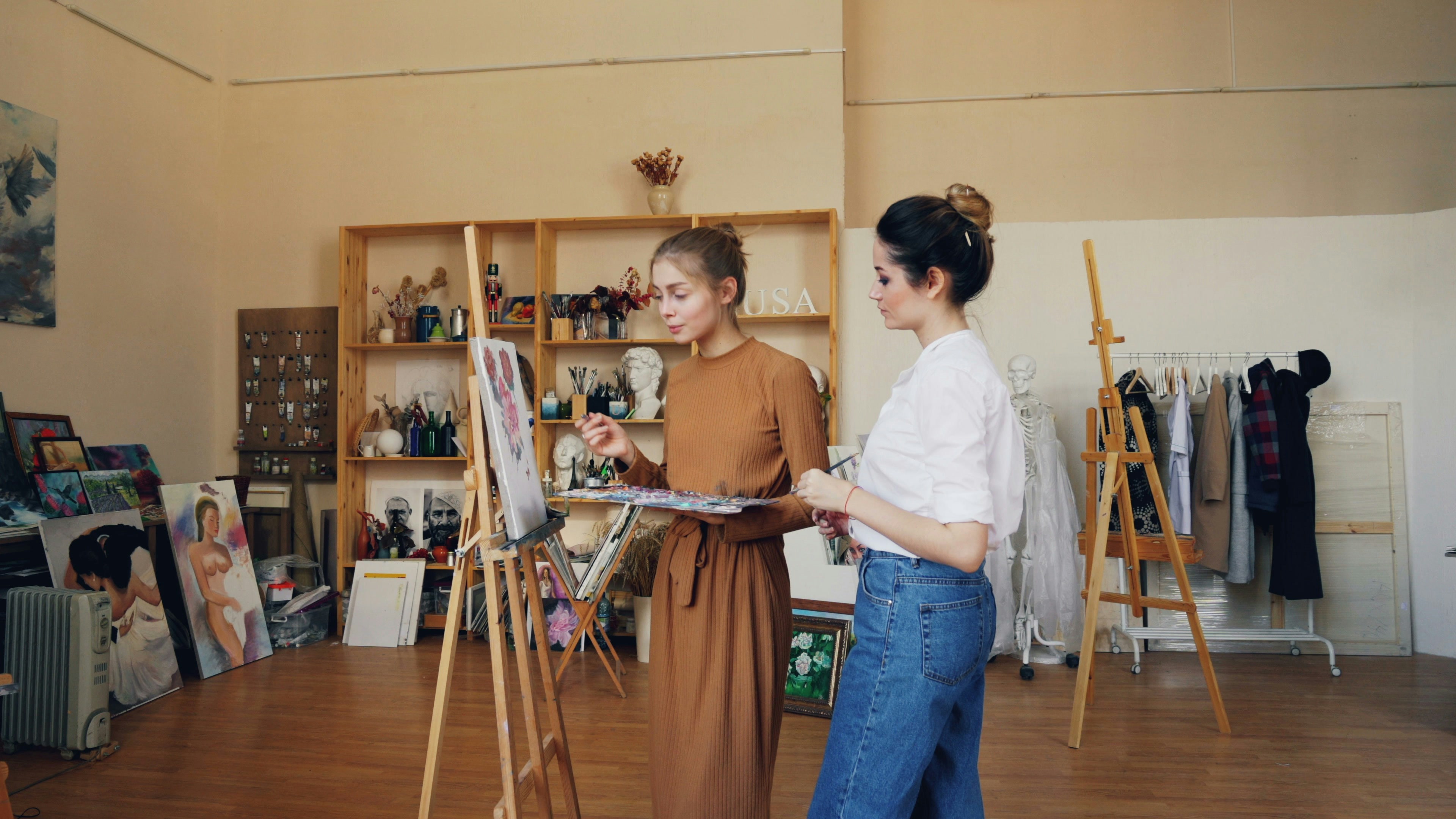 Cheerful young lady painting