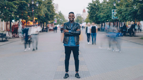free dating sites for short guys – confident man smiling on a city street