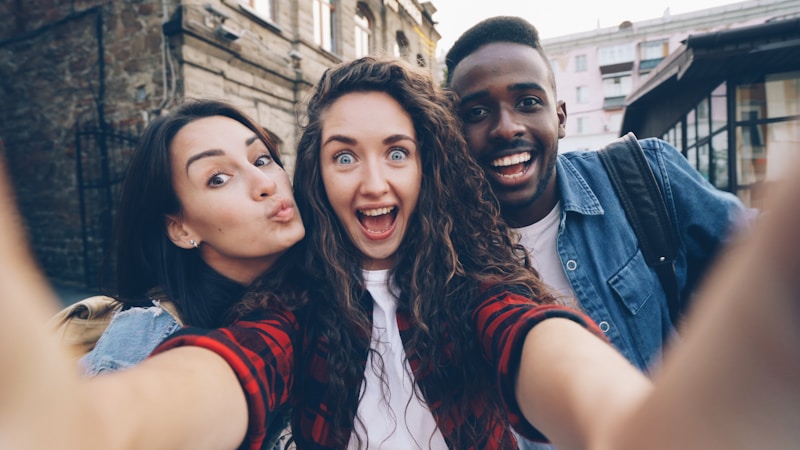Three friends take a selfie.
